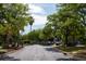 Tree lined street with a U.S. flag and lush foliage for a peaceful community atmosphere at 1300 Park West Blvd # 919, Mount Pleasant, SC 29466
