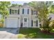 Charming two-story home with a garage and landscaped front yard at 132 E Hartwick Ln, Goose Creek, SC 29445