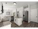 Kitchen features an island, stainless steel appliances, white cabinets, and modern fixtures at 132 E Hartwick Ln, Goose Creek, SC 29445