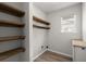 Functional laundry room featuring built-in shelving and a countertop for folding at 132 E Hartwick Ln, Goose Creek, SC 29445