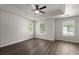 Spacious main bedroom boasting hardwood floors, a ceiling fan, and bright, sunlit windows at 132 E Hartwick Ln, Goose Creek, SC 29445