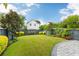 Beautiful backyard featuring lush green grass, manicured landscaping, and a concrete patio at 1331 Smythe St, Daniel Island, SC 29492