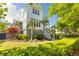Beautiful backyard with lush landscaping, a well-manicured lawn, and a charming exterior elevation at 1331 Smythe St, Daniel Island, SC 29492