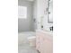 Bathroom with a pink vanity, patterned tile floor, a window, and a tub-shower at 1331 Smythe St, Daniel Island, SC 29492