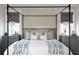 Neutral bedroom features a four-poster bed with textured pillows and dual nightstands at 1331 Smythe St, Daniel Island, SC 29492