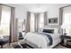 Bright bedroom features neutral tones, stylish decor, large windows, and wood floors at 1331 Smythe St, Daniel Island, SC 29492