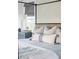 Close up on the bed details in a modern bedroom featuring lots of light at 1331 Smythe St, Daniel Island, SC 29492