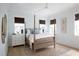 This charming bedroom is brightly lit and features a neutral color palette and light hardwood floors at 1331 Smythe St, Daniel Island, SC 29492