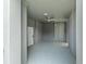 Covered breezeway featuring painted floors, a ceiling fan, and a side entry door at 1331 Smythe St, Daniel Island, SC 29492