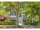 Charming home with a welcoming front porch, lush landscaping, and a grand shade tree at 1331 Smythe St, Daniel Island, SC 29492