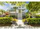 Charming two-story home with a beautiful landscaped front yard and inviting double porches at 1331 Smythe St, Daniel Island, SC 29492