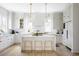 Bright, modern kitchen with white cabinets, a large island, and stainless steel appliances at 1331 Smythe St, Daniel Island, SC 29492