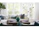 Elegant living room featuring a comfortable sofa, stylish decor, and abundant natural light at 1331 Smythe St, Daniel Island, SC 29492