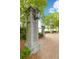 Charming park entrance with stone pillars and benches overlooking a serene lake at 1331 Smythe St, Daniel Island, SC 29492