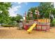 Fun pirate-themed playground with a yellow slide and wooden structures for imaginative play at 1331 Smythe St, Daniel Island, SC 29492