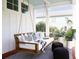 Relaxing porch featuring a comfortable swing, stylish pillows, and serene outdoor ambiance at 1331 Smythe St, Daniel Island, SC 29492
