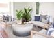Inviting porch featuring comfortable seating, decorative plants, and a stylish outdoor rug at 1331 Smythe St, Daniel Island, SC 29492