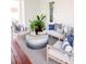 Cozy porch with a stylish seating arrangement, perfect for relaxing outdoors with plants and natural light at 1331 Smythe St, Daniel Island, SC 29492