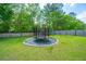 Backyard featuring a trampoline, a playground and privacy fence at 137 Clydesdale Cir, Summerville, SC 29486