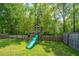 A fenced backyard is equipped with a well-maintained playset at 137 Clydesdale Cir, Summerville, SC 29486