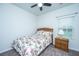 Well-lit bedroom features a floral comforter set, wood furniture, and a ceiling fan at 137 Clydesdale Cir, Summerville, SC 29486