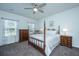 Cozy bedroom featuring a four-poster bed, soft lighting, and a window view at 137 Clydesdale Cir, Summerville, SC 29486