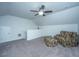 Spacious bonus room features vaulted ceilings, ceiling fan, and decorative chair set at 137 Clydesdale Cir, Summerville, SC 29486