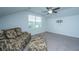 Bonus room features a ceiling fan, vaulted ceiling, and large windows for natural light at 137 Clydesdale Cir, Summerville, SC 29486