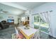 Open dining room with a sliding glass door, offering easy access to the outdoor patio, perfect for indoor-outdoor living at 137 Clydesdale Cir, Summerville, SC 29486