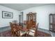 Elegant dining room with hardwood floors, a large wooden table, and a classic china cabinet at 137 Clydesdale Cir, Summerville, SC 29486