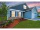 Charming home featuring a two-car garage, a welcoming front yard, and lovely landscaping near the house's entrance at 137 Clydesdale Cir, Summerville, SC 29486
