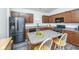 Stylish kitchen boasts granite countertops, a stainless steel refrigerator, modern appliances, and ample cabinet space at 137 Clydesdale Cir, Summerville, SC 29486