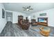 Open-concept living room features hardwood floors, neutral walls, and comfortable furniture for relaxation and entertainment at 137 Clydesdale Cir, Summerville, SC 29486
