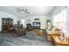 Spacious living room with hardwood floors, plush seating, and a decorative ceiling fan creates a comfortable space at 137 Clydesdale Cir, Summerville, SC 29486