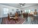 Open-concept floor plan featuring dining and living areas, with hardwood floors and ample natural light at 137 Clydesdale Cir, Summerville, SC 29486