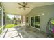 Relaxing screened-in porch with ceiling fan overlooks the backyard and green space at 137 Clydesdale Cir, Summerville, SC 29486