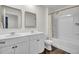 The bathroom features double sinks, white cabinets, shower, and tub at 138 Sweet Cherry Ln, Summerville, SC 29486