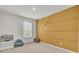 Bedroom featuring a unique accent wall, window and neutral decor at 138 Sweet Cherry Ln, Summerville, SC 29486
