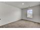 This room has neutral walls and carpet, and a window with blinds at 138 Sweet Cherry Ln, Summerville, SC 29486