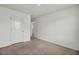 A simple room with neutral carpet and trim and a single door at 138 Sweet Cherry Ln, Summerville, SC 29486