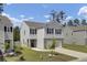 Charming two-story home with a well-manicured lawn, features a garage and a welcoming front door at 138 Sweet Cherry Ln, Summerville, SC 29486