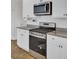 Modern kitchen equipped with stainless steel oven, microwave, and white cabinets at 138 Sweet Cherry Ln, Summerville, SC 29486