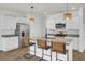 Bright kitchen with stainless steel appliances, granite countertops, and a stylish central island at 138 Sweet Cherry Ln, Summerville, SC 29486