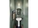 This powder room features green walls, and a pedestal sink with a round mirror at 138 Sweet Cherry Ln, Summerville, SC 29486