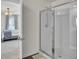 Walk-in shower with glass door and modern fixtures, adjacent to a well-appointed bedroom at 138 Sweet Cherry Ln, Summerville, SC 29486