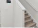 A clean stairway features neutral carpet and white risers and railing at 138 Sweet Cherry Ln, Summerville, SC 29486