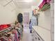 Walk-in closet with rows of hanging clothes and shelving at 1511 Fairway Dr, Charleston, SC 29412