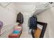 Walk-in closet featuring metal racks, bench, and folded items at 1511 Fairway Dr, Charleston, SC 29412