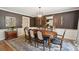 Elegant dining room with a large wooden table, chairs, and a decorative chandelier at 1511 Fairway Dr, Charleston, SC 29412