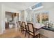 Charming dining area with a skylight, a window seat, and a large wooden table at 1511 Fairway Dr, Charleston, SC 29412